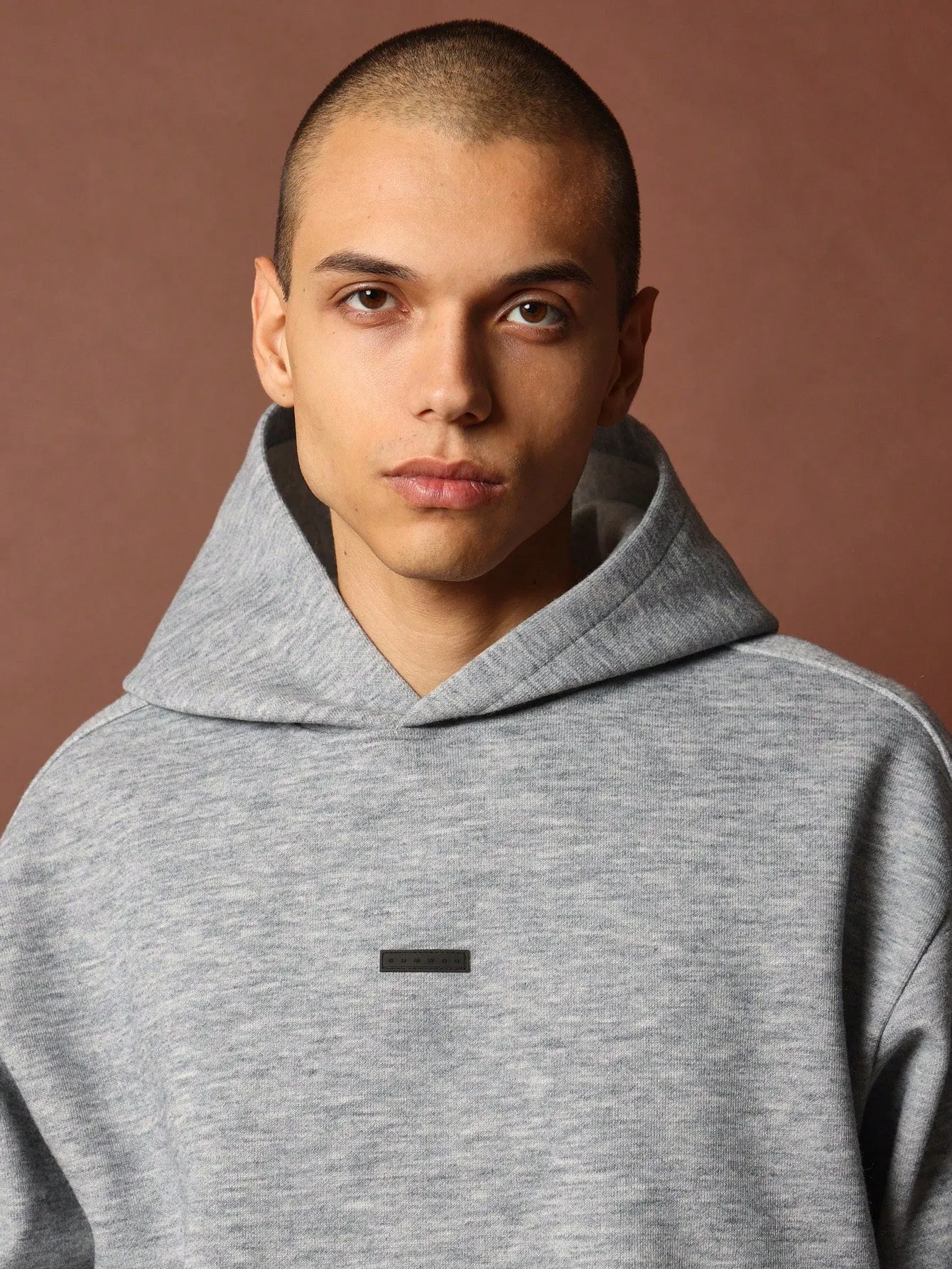 Crop Fit Overhead Raw Hem Hoodie With Silicon Badge