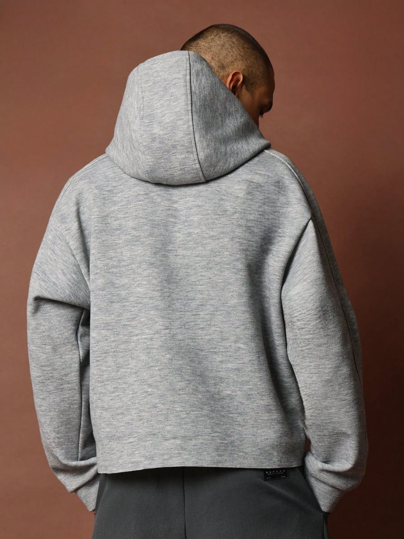 Crop Fit Overhead Raw Hem Hoodie With Silicon Badge